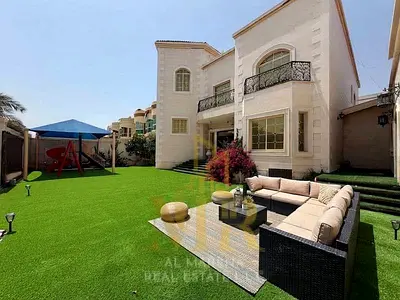 Luxury villa for sale in Al Rawda 3 | Area: 10,000 sq. ft. | Two floors plus a roof terrace | 9 mas