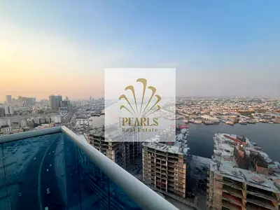 For Annual Rent in Oasis Tower, 2 Bedrooms + Living Room, Higher Floor, Balcony, Open View, Gym & Swimming Pool, Parking,