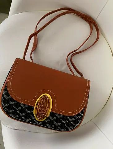 Copy a Brown leather-trim shoulder bag with patterned canvas and gold clasp