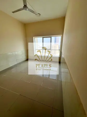 For annual rent in Al Rashidiya 1 (Pearl Towers): 2 bedrooms, a living room, 2 bathrooms, two balconies private parking and an open view