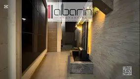 Luxurious, fully furnished villa for sale in Al-Yasmeen, featuring high-end finishes.