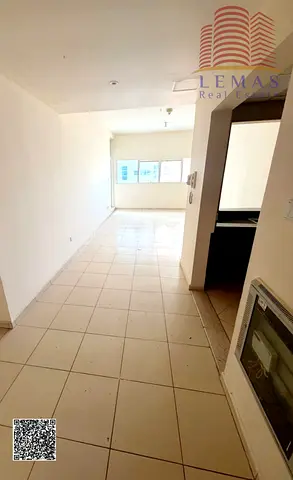 Two bedroom open kitchen empty flat with parking for rent, Ajman One Towers