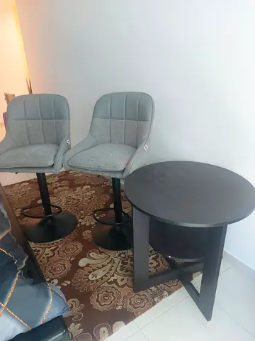 Pair of grey bar stools with small round black bar table - good condition