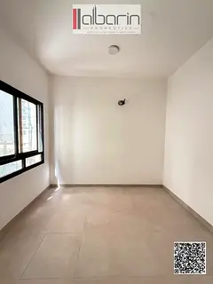 Two-bedroom apartment with a living room for rent in Al-Aliya – AED 44,000 per year.