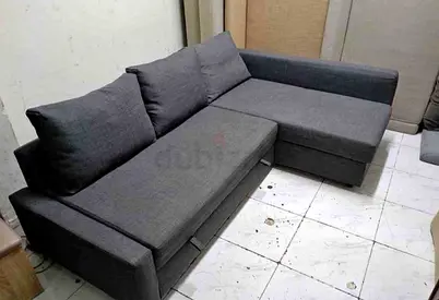 Dark grey L-shaped sectional sofa bed good condition