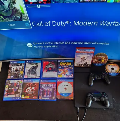 PlayStation 4 Slim with 2 original Controllers and 12 Games