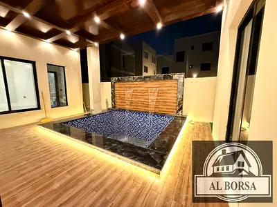 For rent a villa in Al Helio 2 in Ajman, 6 master bedrooms, a majlis, a hall, a maid's room, and a store