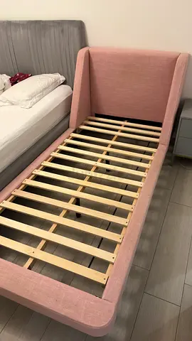 Single pink upholstered bed frame - good condition