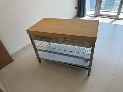 Stainless Steel Kitchen Island Cart with Wooden Top and Drawers for storage. 8 months old
