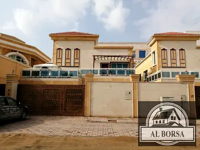 For sale in Al Muwaihat 2, a villa with 6 master bedrooms, a majlis, a living room, a maid's room, and a spacious kitchen.