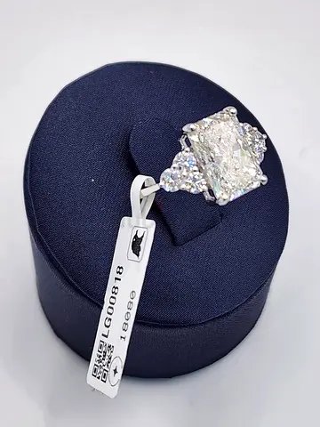 Diamond cluster engagement ring - center radiant cut with side stones