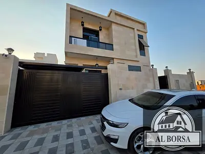 Villa for rent in Al Yasmin area, 5 master bedrooms, majlis, living room, ground floor, first floor, and roof, with kitchen and maid's room.