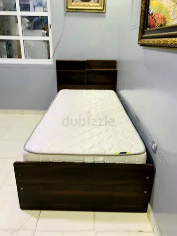 Single wooden bed frame with mattress and headboard storage - good condition