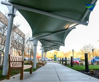 Outdoor covered walkway canopy with benches — durable shade structure
