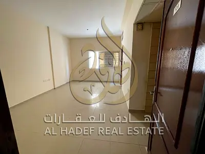 Spacious Studio for Rent in Al Butina, Sharjah, Side Kitchen, Central AC & Gas, Prime Location Behind Nesto and Payment in 4 Cheques