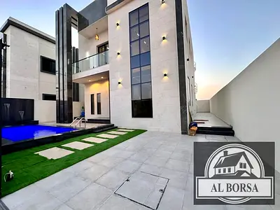 For sale in Al Bahia, Ajman: a villa with 4 master bedrooms, a majlis, a living room, and a swimming pool.