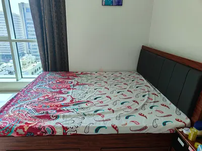 Wood frame double bed with padded headboard - good condition
