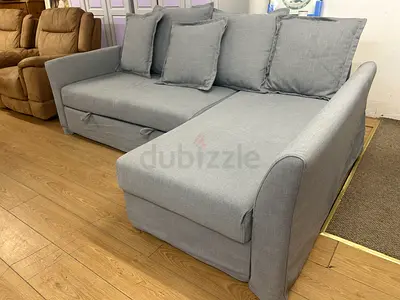 Light grey L-shaped sofa with chaise and removable cushions - good condition