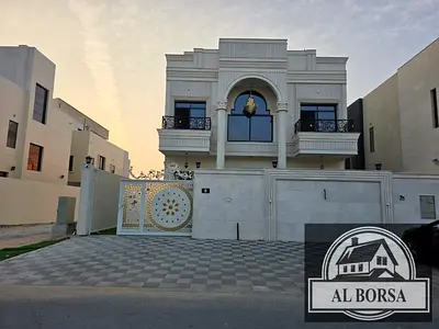 Villa for sale in Al Zahia, Ajman. 7 bedrooms, majlis, living room, spacious kitchen, and maid's room.