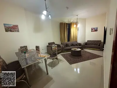 Furnished two-bedroom apartment with a living room and an open view for rent.