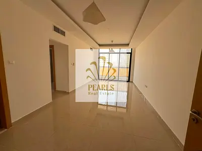 Second-occupancy unit in Al Jurf featuring two master bedrooms, a luxurious living area, a balcony, and central air conditioning; priced at AED 42,973