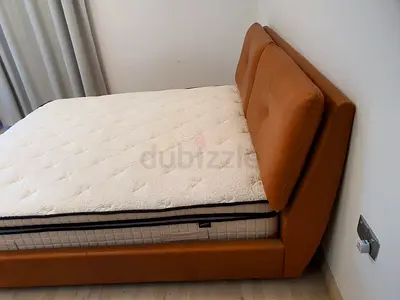 Queen leather-upholstered bed frame with mattress - good condition