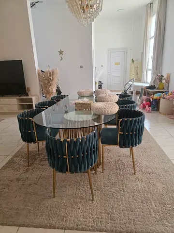 Glass-top dining table with 8 upholstered velvet chairs - set in good condition