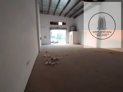مستودع 1800 قدم مسطح واحد وكهرباء 21 كيلو على طريق رئيسي بالجرف الصناعية 1