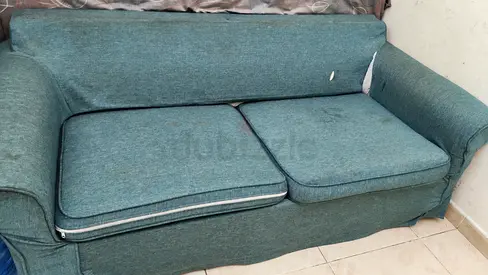 Two-seater green fabric sofa - used, cushions included