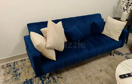 Blue velvet 3-seater sofa. Back Drops to covert to small bed. in good condition