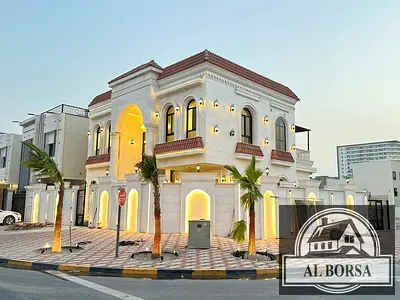 For sale in Al Helio 1, Ajman: a villa with 5 master bedrooms, a majlis, two living rooms, a kitchen, and a maid's room.