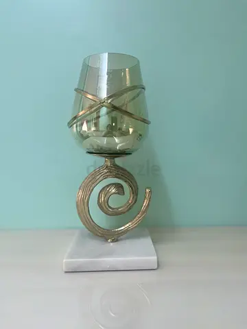 Decorative spiral glass hurricane candle holder on marble base