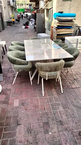 Marble-top dining table with 8upholstered chairs - good condition