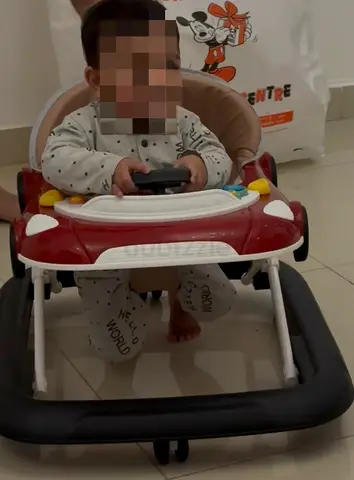 Used baby walker with play tray — good condition