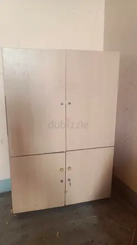 Light wood 4-door storage cabinet / cupboard - good condition