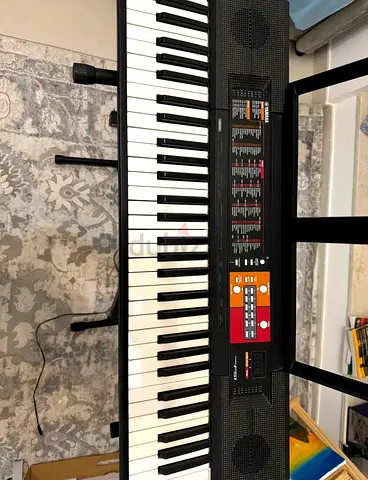 Yamaha piano with stand and chair