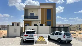 Villa for Sale or Rent in Al Zahya, Ajman, featuring two floors and a large yard. The property sits 