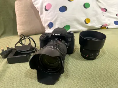 Canon EOS 760D DSLR with 18-135mm kit lens + extra prime lens, charger and speedlite.