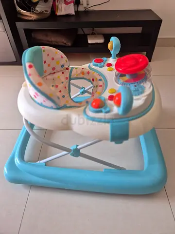 Light blue baby walker with activity tray — good condition