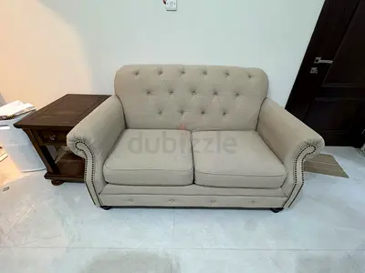 Beige 2-Seater Tufted Sofa – Good Condition