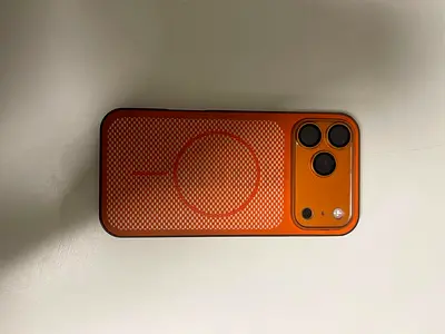 iPhone 17Pro max in Orange Protective Case (Good Condition)