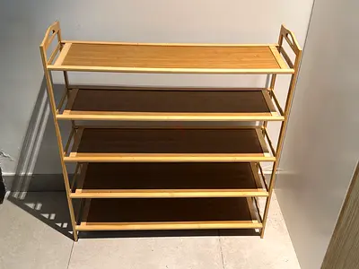 Compact bamboo shoe rack in very excellent condition.