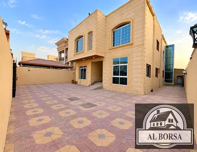For sale in Al-Rawdah 1: A luxury villa featuring 6 bedrooms, a majlis, three living areas, and an elevator; layout includes ground floor, first floor