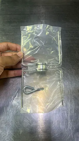 Small metal clip and pin in sealed plastic bag - unused