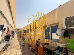 Labor accommodation and two sheds for sale in the Old Sajaa Industrial Area, Sharjah; total area: 20