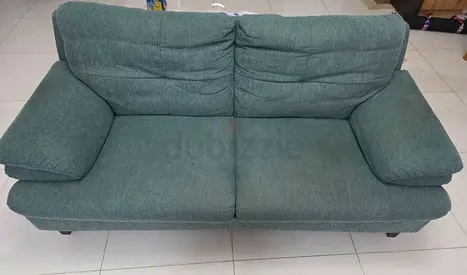 2-seater pan teal fabric sofa in good used condition