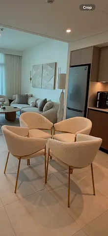 Set of 4 white upholstered dining chairs with gold metal legs