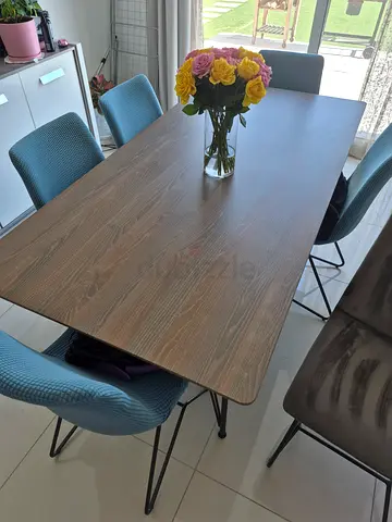 Great condition modern dining table and 6 grey velor chairs with seat covers