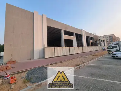 3 commercial showrooms for annual rent in Al Mowaihat 3, Ajman. Each showroom is 17,000 sq ft. Rent one or more. AED 1.2M per showroom, suitable for v