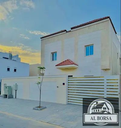 Villa for rent in Al Yasmeen, Ajman, featuring 5 master bedrooms, a majlis, a living area, and a spacious kitchen with a maid's room.